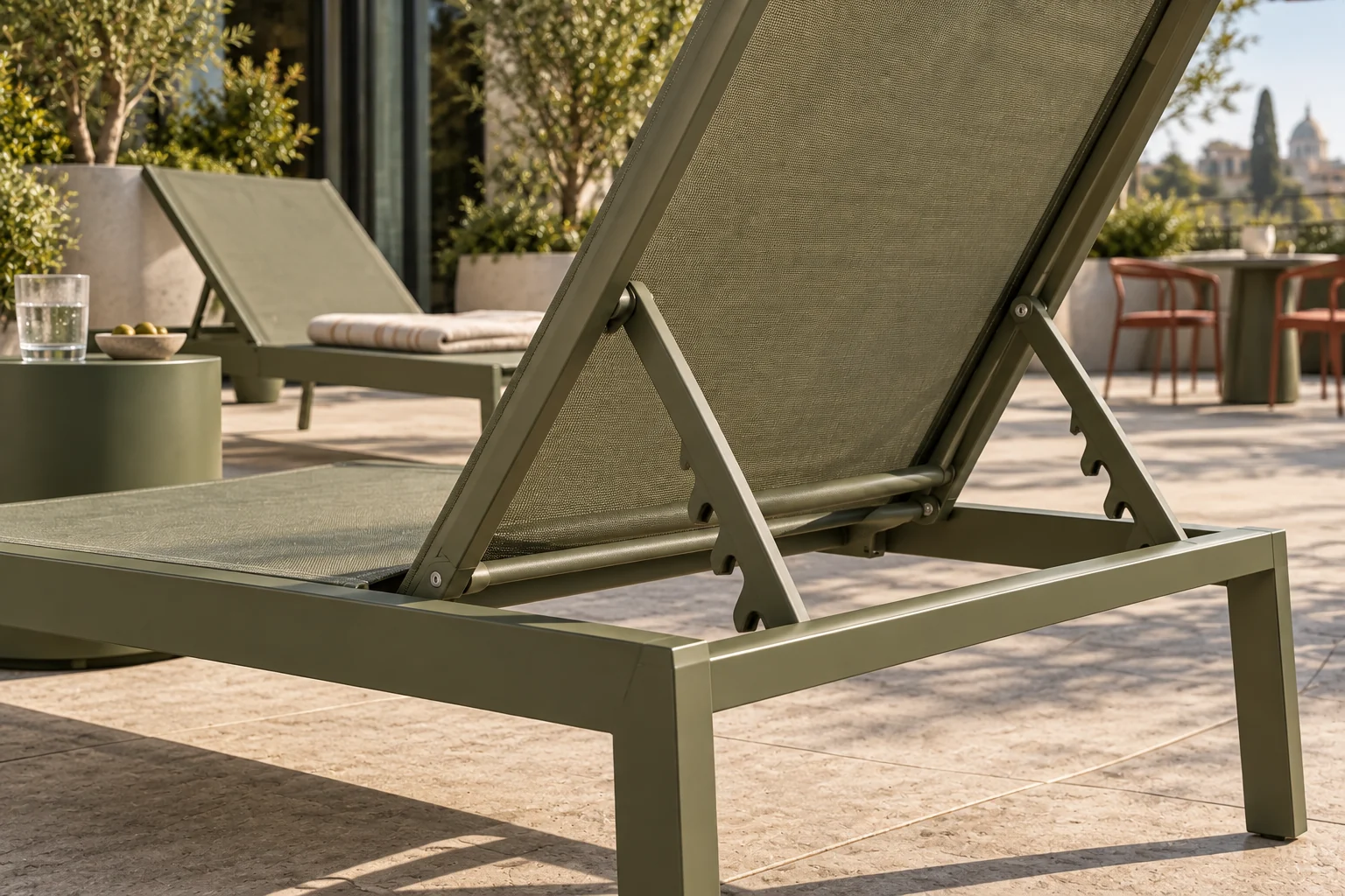 Close view of olive sling lounger mesh and aluminium frame joints