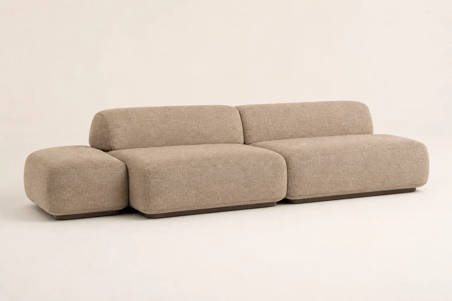 Dune Modular Sofa studio concept visual in clay chenille, recessed dark-oak plinth