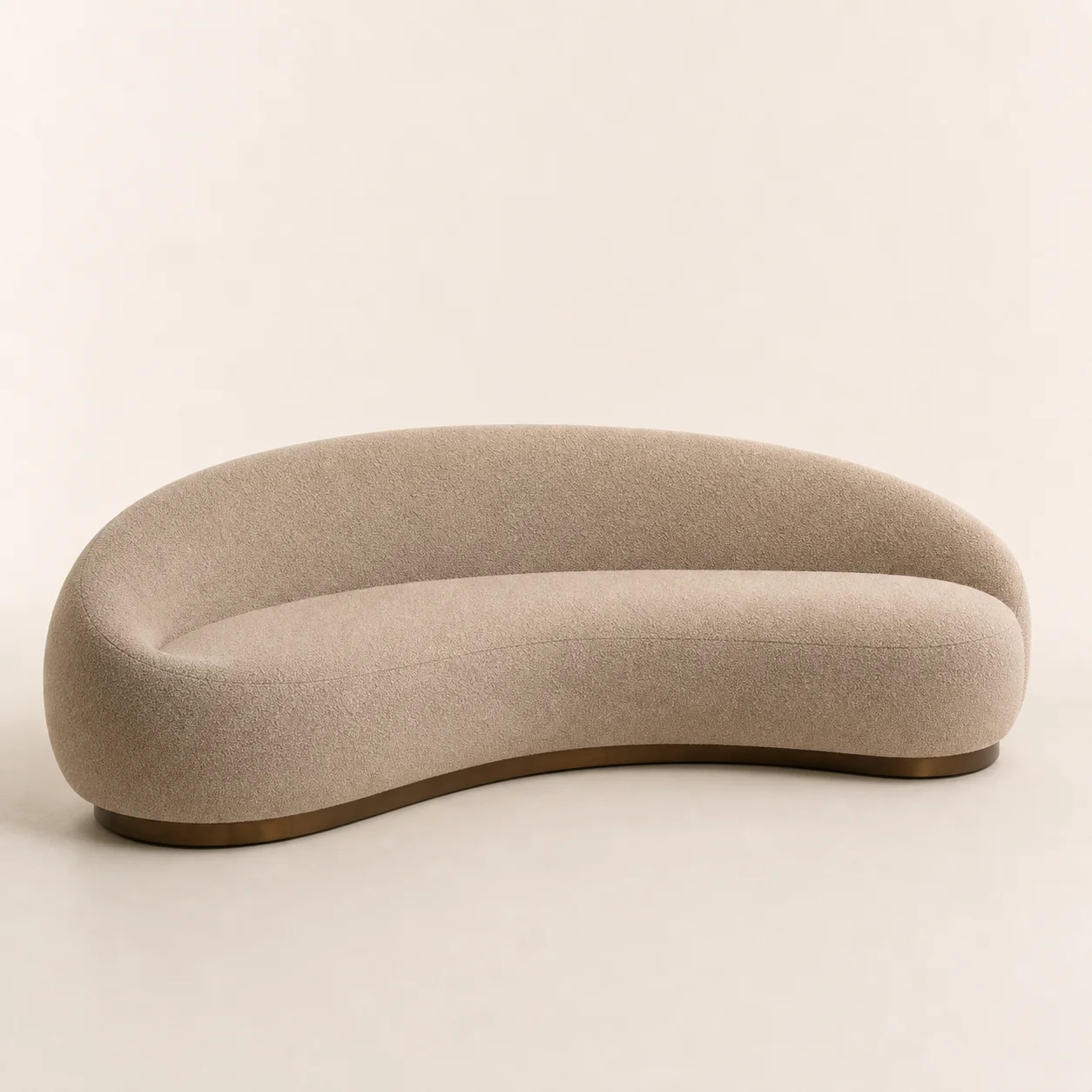 Qamar Crescent Sofa studio concept visual in warm sand textile, bronze shadow base
