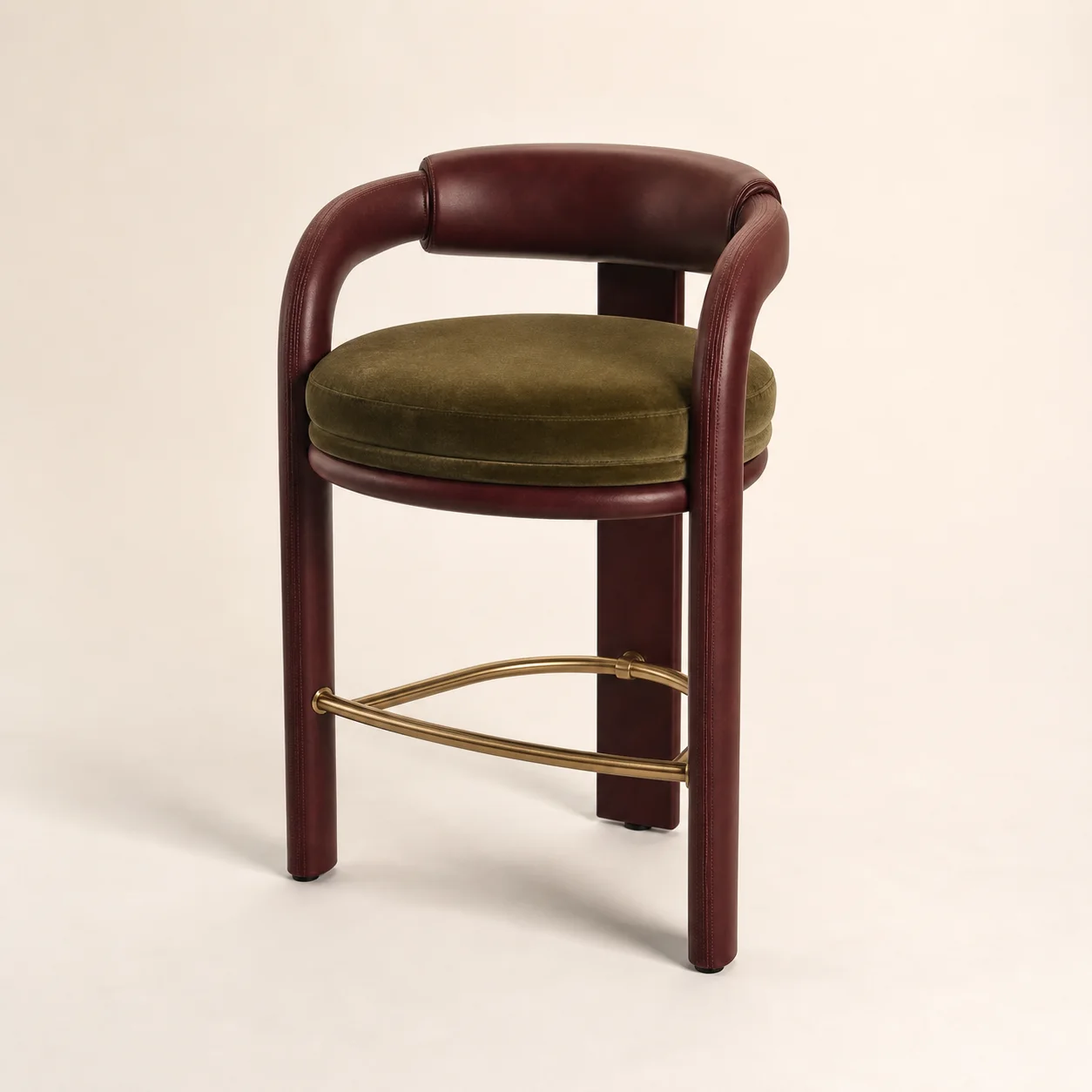Firenze Bar Stool studio concept visual in oxblood leather, olive velvet, brass foot rail