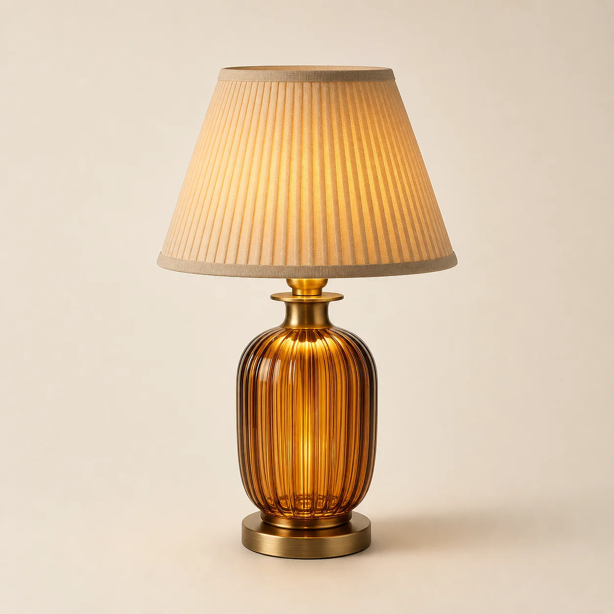 Gio Pleated Glass Lamp studio concept visual in amber glass, champagne brass, ivory shade
