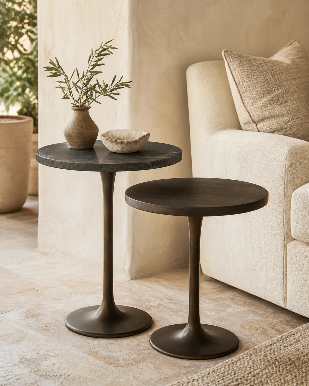 Cala pair of dark bronze nesting side tables beside lounge seating