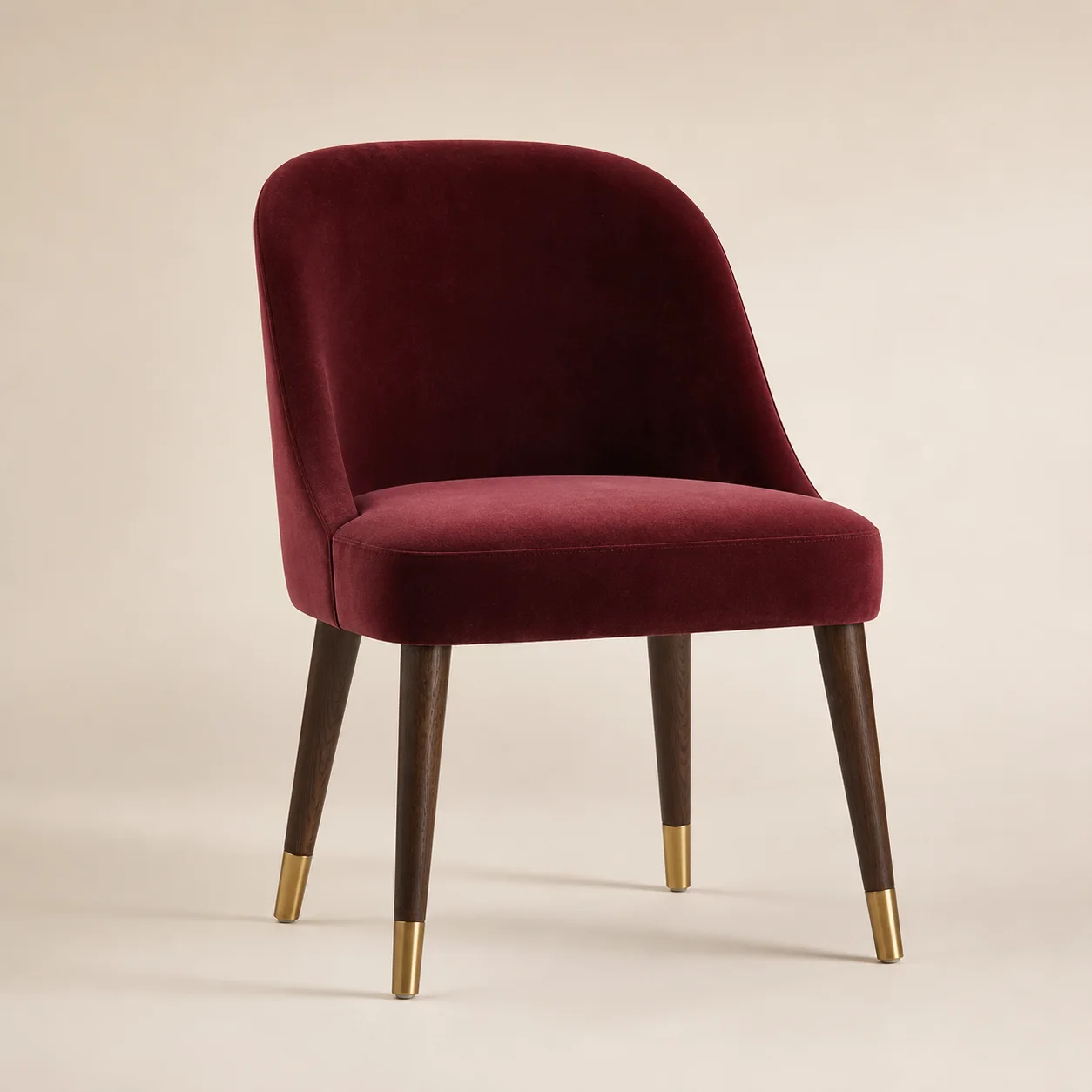 Vesper Dining Chair studio concept visual in oxblood velvet, dark walnut, satin brass