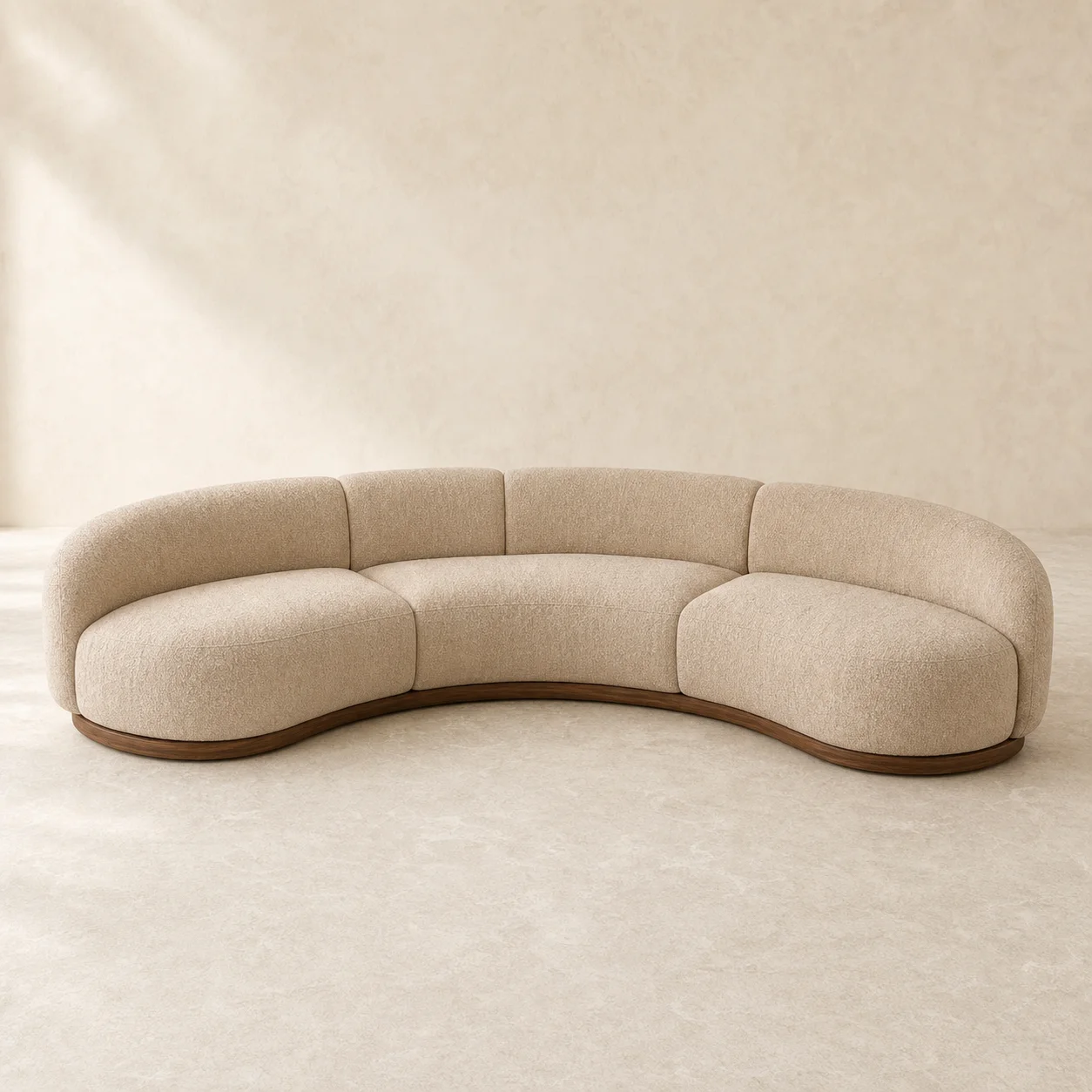 Tierra Crescent Sofa studio concept visual in clay-sand textile, dark timber shadow base