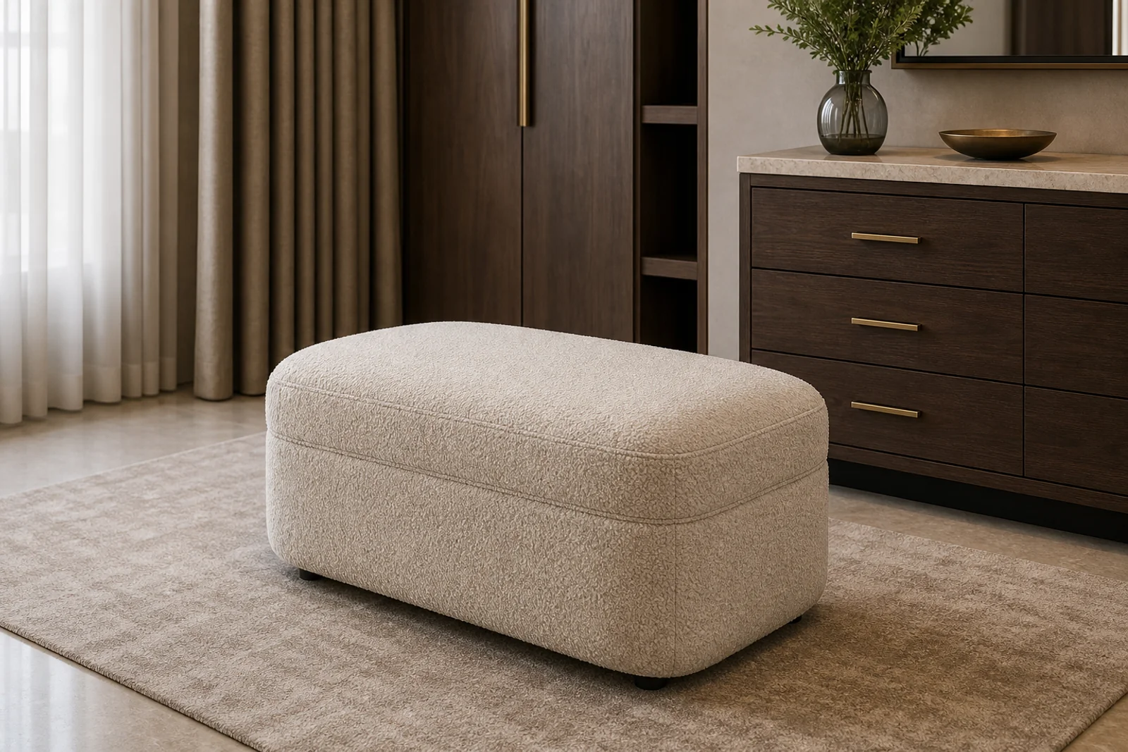 Ivory boucle upholstered pouf with rounded rectangular form