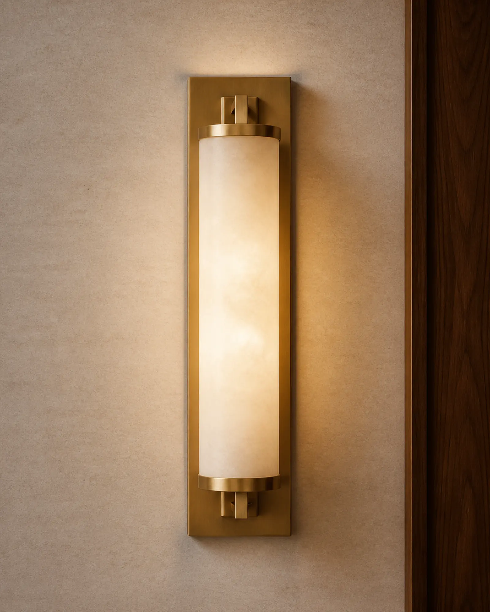 Wall Sconce profile - Brass wall sconce with frosted diffuser on a walnut hotel wall panel