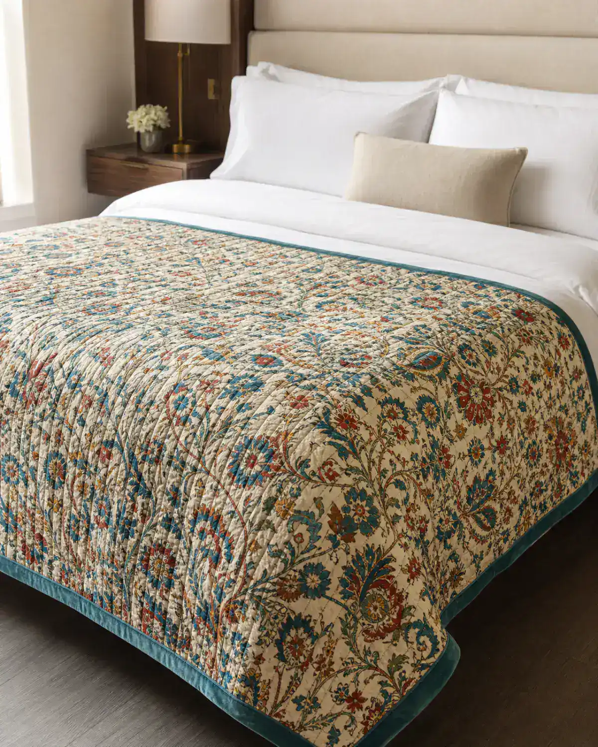 Tidal Garden quilted bed coverlet with original teal, garnet, and saffron botanical motif