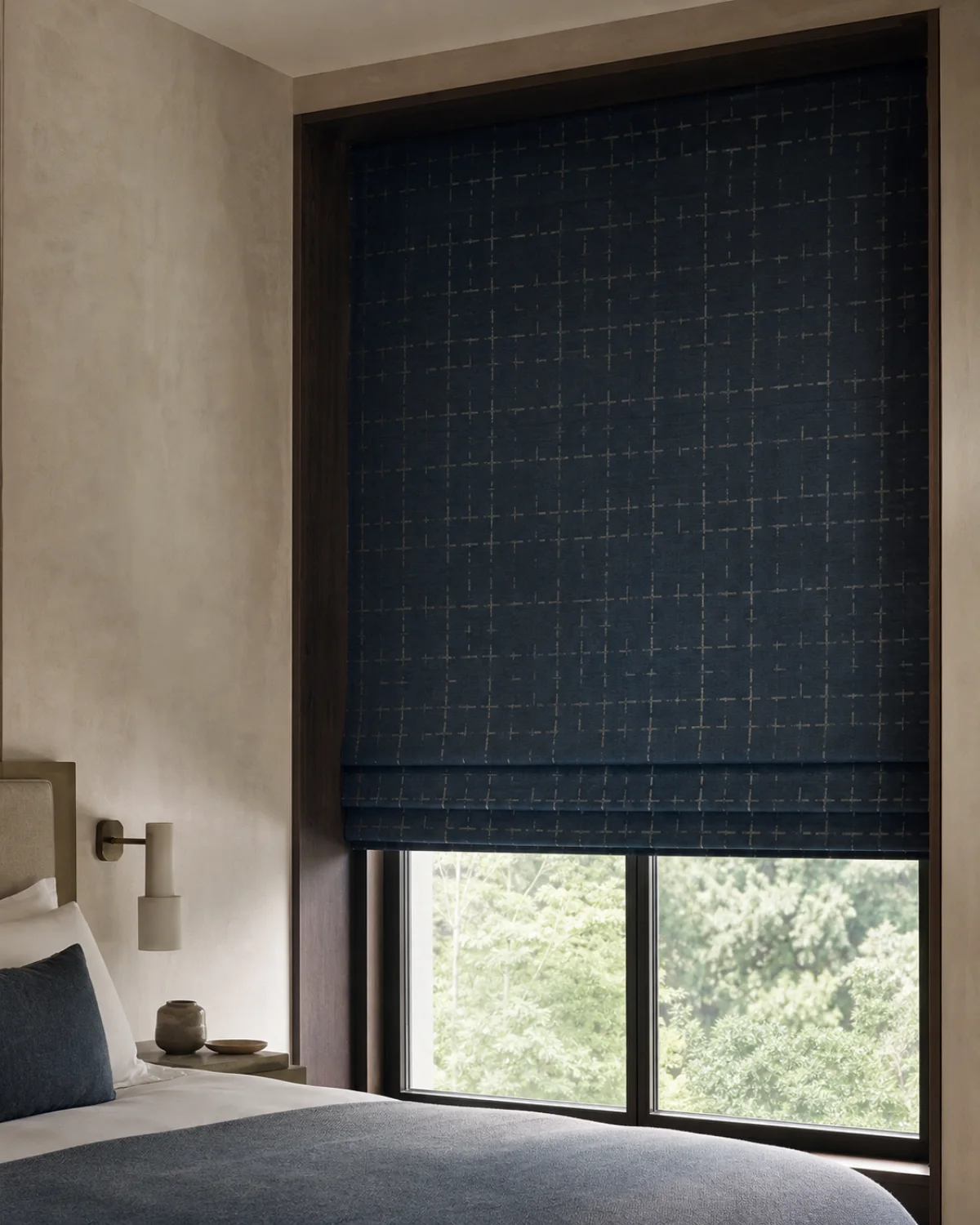 Indigo Vale Roman blind in deep indigo linen with original celadon broken-grid jacquard