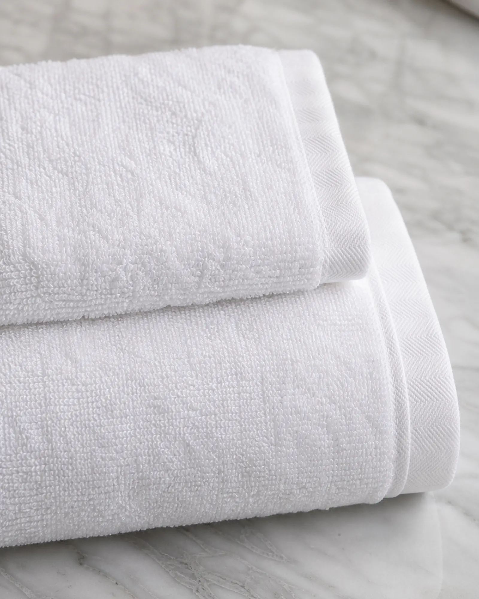 Face / Hand Towel profile - Small white face and hand towels folded for a hotel bathroom